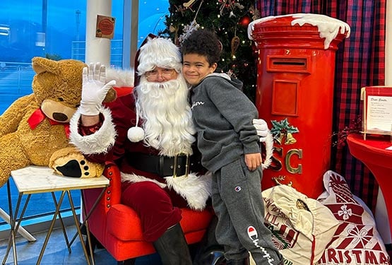 Santa Claus meeting a child.